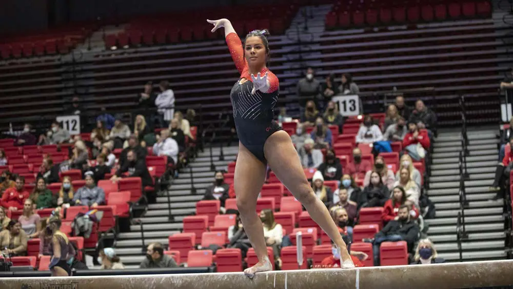 Female gymnast on the balance beam