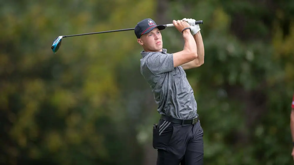 Golfer swinging a club