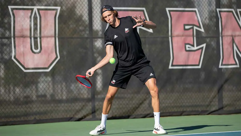 Tennis player swinging a racket