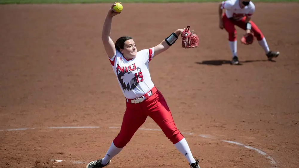 Softball player pitching