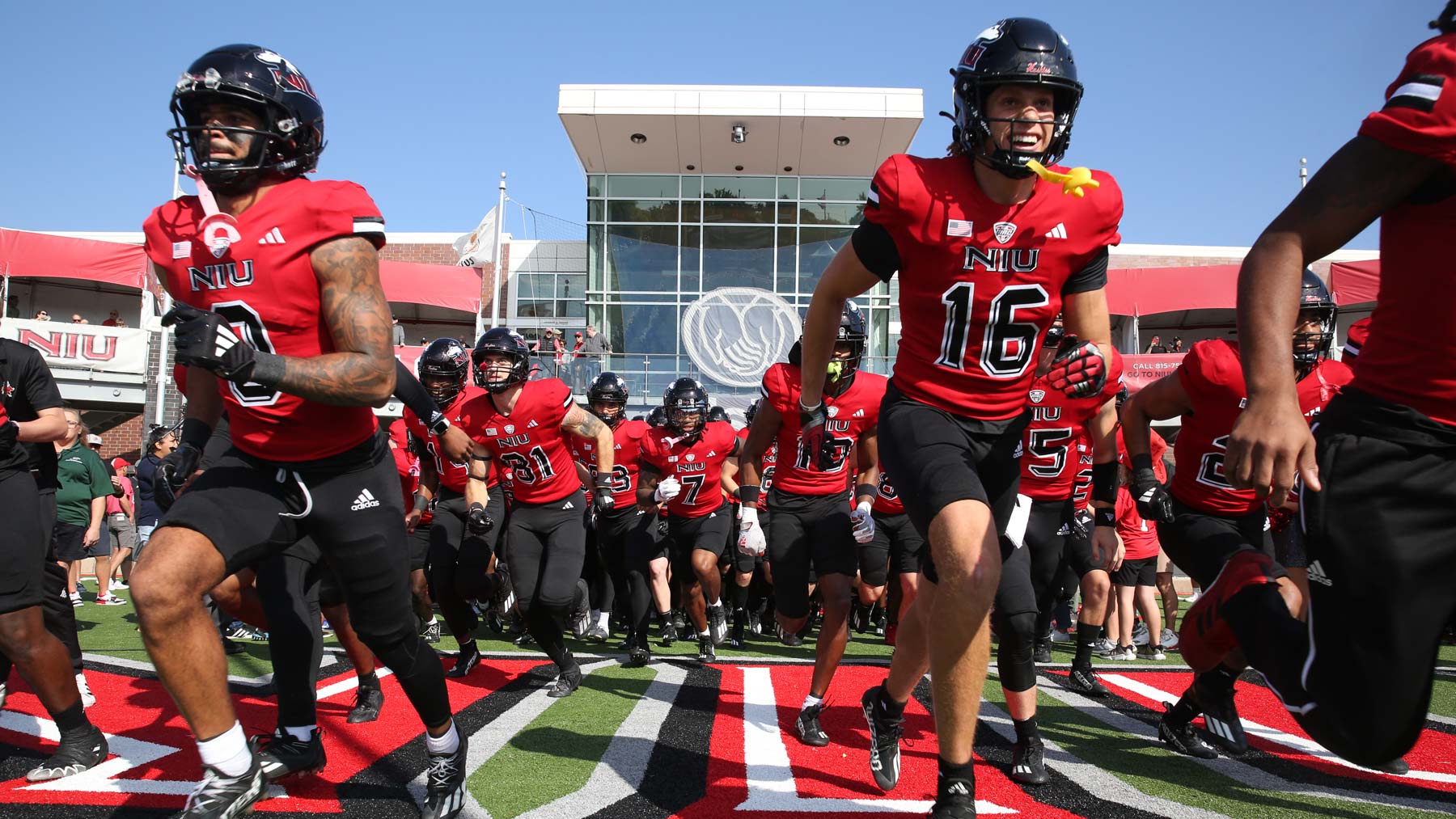 Football players running out onto the field