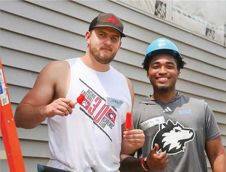 Two men giving thumbs up