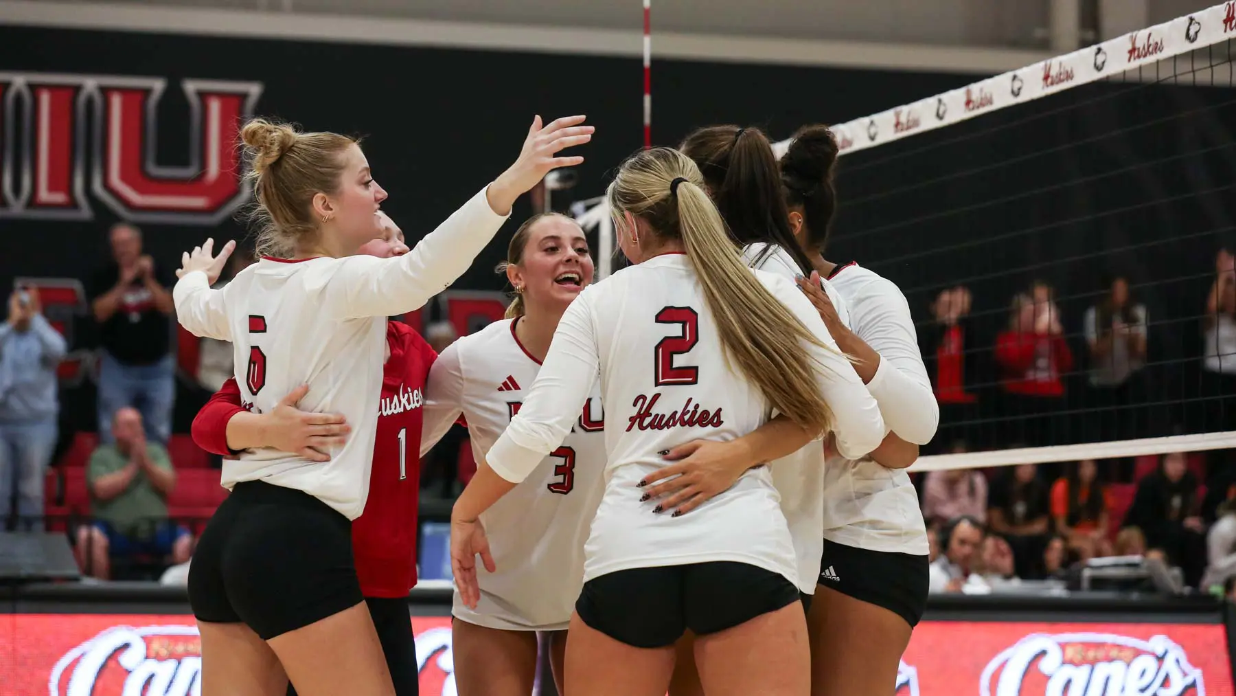 volleyball players celebrating