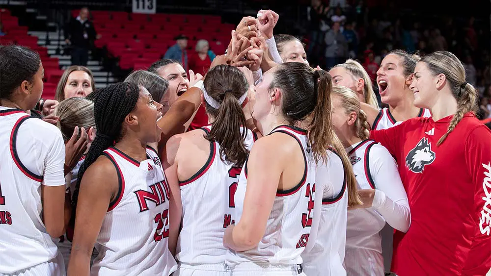 women's basketball players celebrating